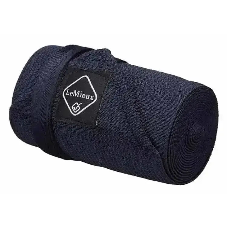 Dark navy blue lemieux tail bandage neatly rolled with matching strap perfect for horse tail bandages use