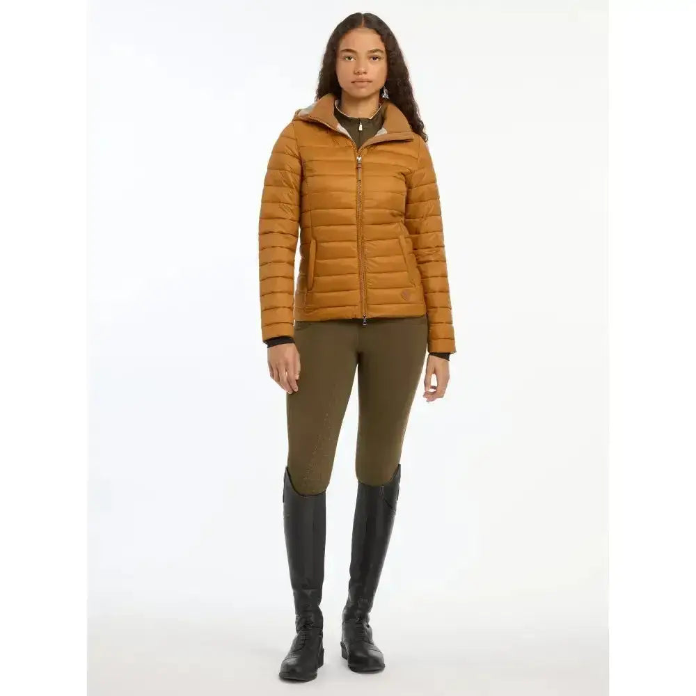 A quilted mustard-yellow lemieux tilly hooded puffer jacket ginger with front zipper perfect for cold days