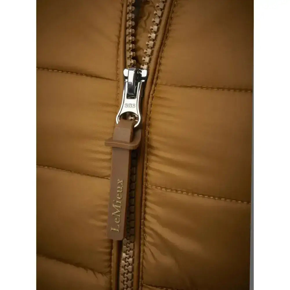 Tan quilted lemieux tilly hooded puffer jacket zipper with silver pull tab and branded leather tag in puffer jacket ginger