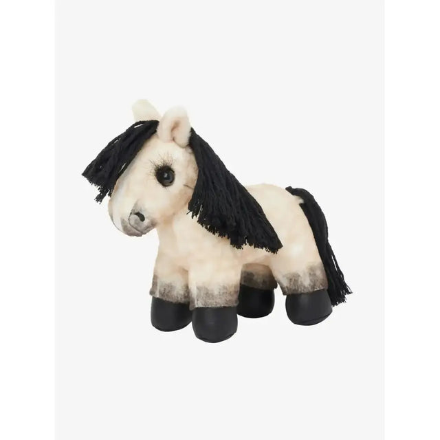 A plush white lemieux tiny pony dream with black tassel mane tail standing on black hoof like feet