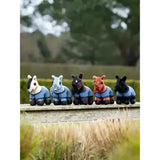 Five lemieux tiny pony figurines wearing blue riding jackets with black accents featuring pony thomas details