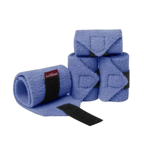Light blue felt pony bandages with black velcro straps and red lemieux toy pony label for luxury fleece polos