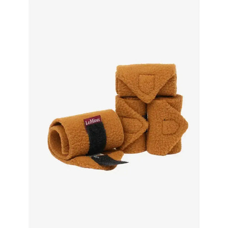 Tan fuzzy lemieux toy pony bandages ginger with black velcro strap and lemieux brand label visible
