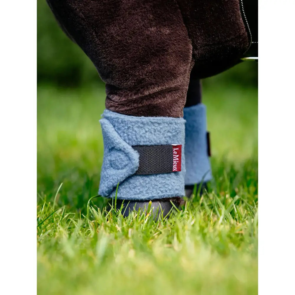 Light blue plush fleece lemieux toy pony bandages ice with black velcro strap and red lemieux brand label