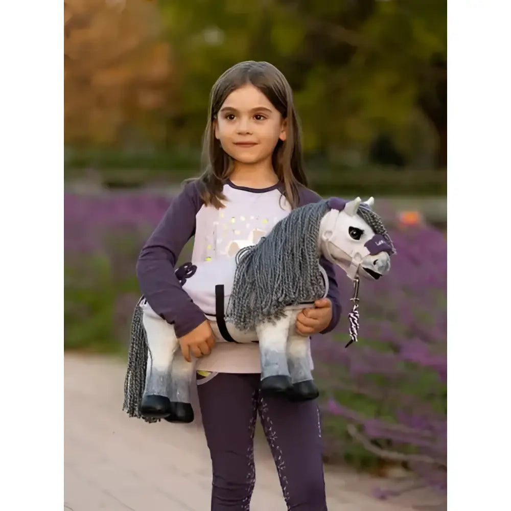 A plush lemieux toy pony blanca with a white gray gradient body black hooves and textured gray mane
