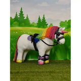 A plush white lemieux toy pony with a rainbow mane wearing pony boots purple shimmer and black harnesses