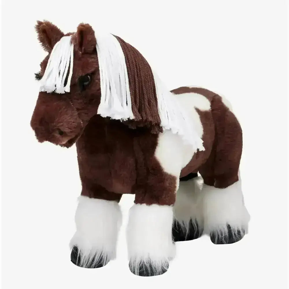 A plush lemieux toy pony dazzle in brown and white with a flowing mane and feathered hooves soft and cuddly