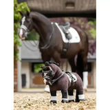 Dark brown plush lemieux toy pony with black mane and white markings wearing a detailed pony double bridle black