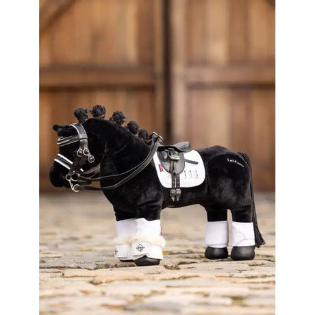 Plush LeMieux Toy Pony with riding gear and braided mane, featuring Reach Boot White