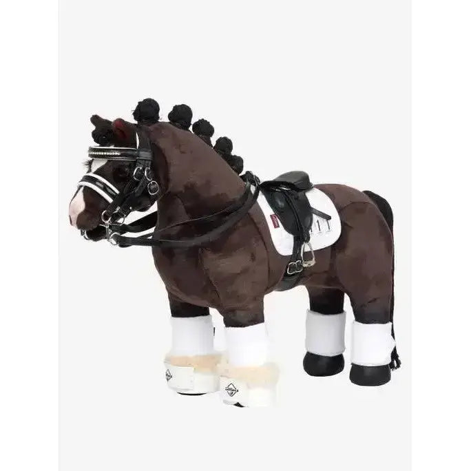 Brown plush lemieux toy pony with black mane white pony dressage pad and saddle gear for toy pony dressage play