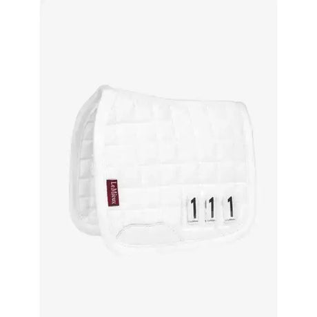 White quilted lemieux toy pony dressage pad with red brand tag and black size labels for pony dressage use