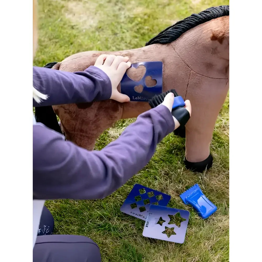 Blue heart-shaped stencil decorating the brown plush lemieux toy pony gracie for a cute personalized look