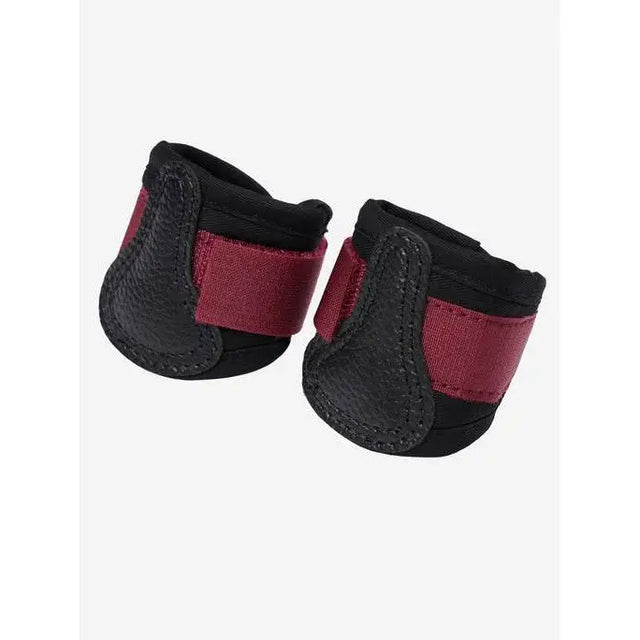 Pair of black and burgundy Lemieux Toy Pony Grafter Boots Ember for overreach protection