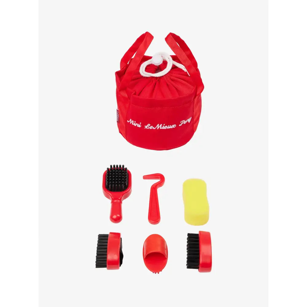 Red fabric bag with horse grooming tools from the Lemieux Toy Pony Grooming Kit Chilli