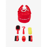 Red fabric bag with horse grooming tools from the Lemieux Toy Pony Grooming Kit Chilli