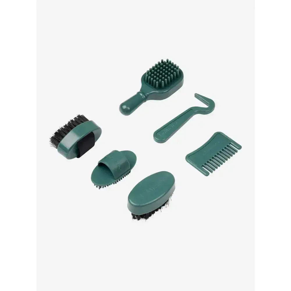 Set of six dark green plastic brushes and combs with black bristles from lemieux toy pony grooming kit sage
