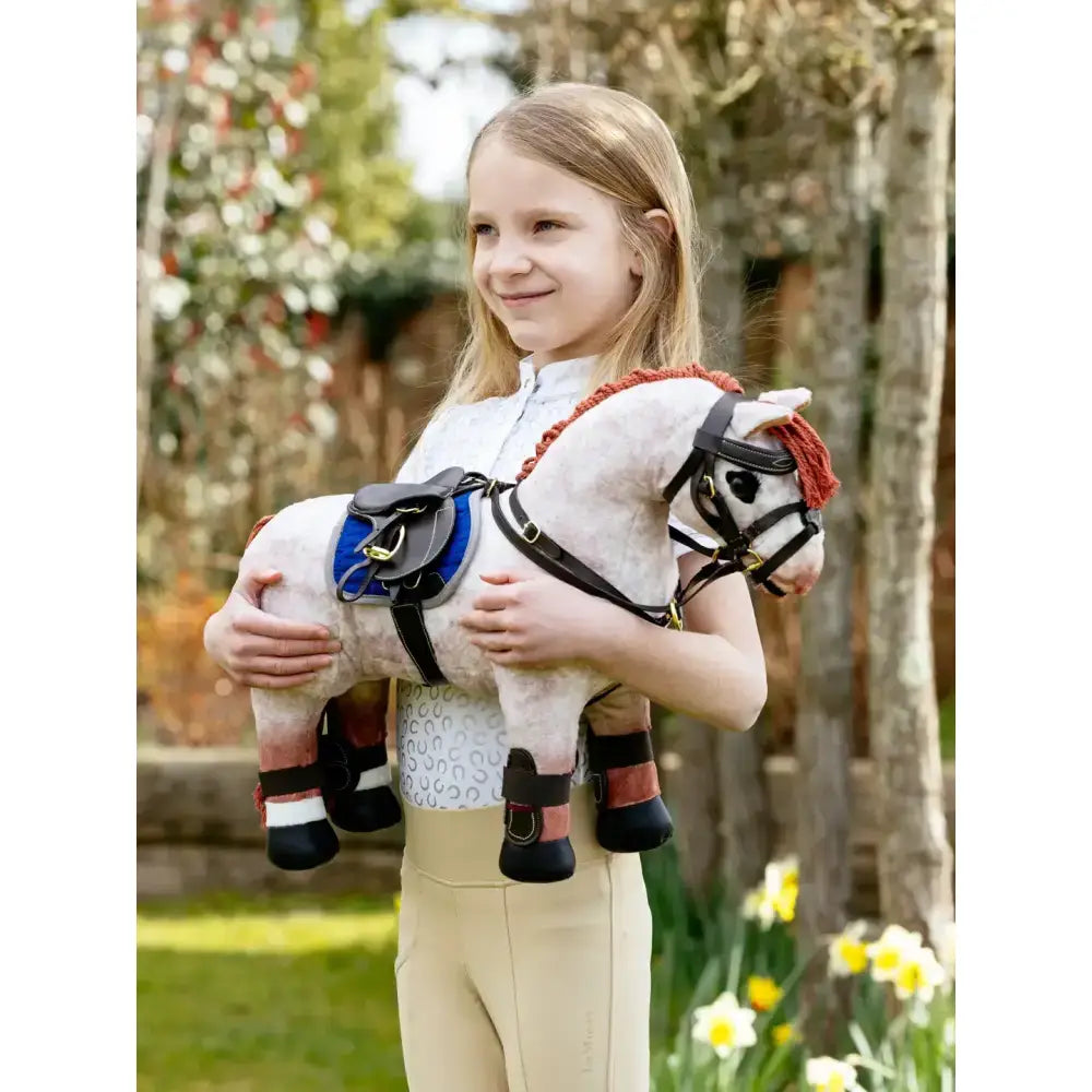 White plush lemieux toy pony with black and red pony jump saddle and stud girth brown details