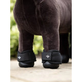 Horse in Lemieux Toy Pony Over Reach Boots Black for leg protection and comfort