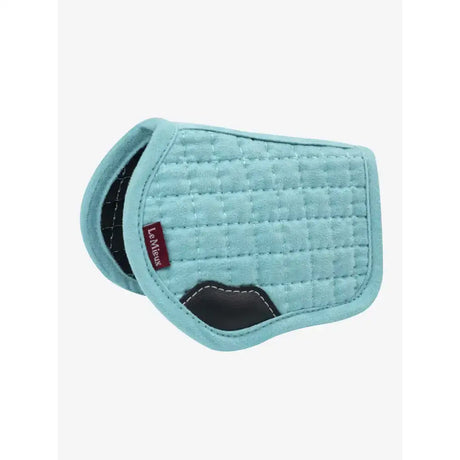 Light blue quilted lemieux toy pony pad azure with black leather accents and red levitt brand tag saddle pad