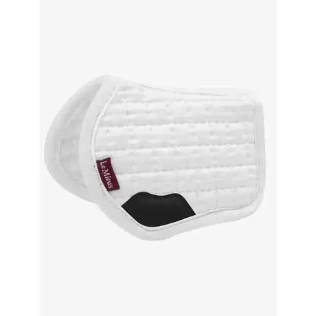 White quilted lemieux toy pony saddle pad with black patch and red lemieux saddle pad brand tag
