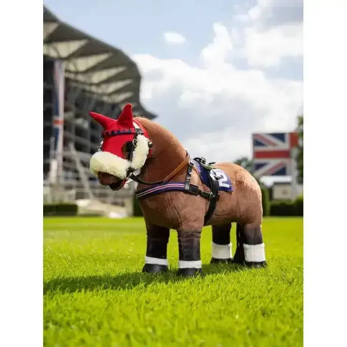 A plush brown lemieux toy pony wearing a red and white pony racing bridle and black-and-white racing bridle set gear