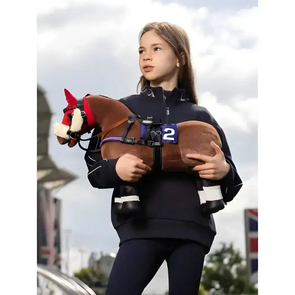 Brown plush lemieux toy pony with red mane, white muzzle, black hooves, wearing a purple pony racing saddle set and number 2 bib
