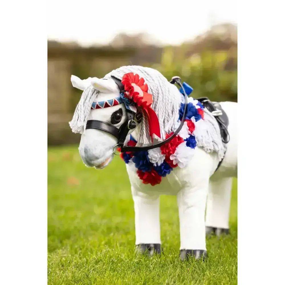 White plastic lemieux toy pony with red white blue fabric flowers and matching pony rosette pack headband