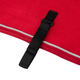 Close-up of black fabric strap with buckle on red felt lemieux toy pony fleece rug chilli back side
