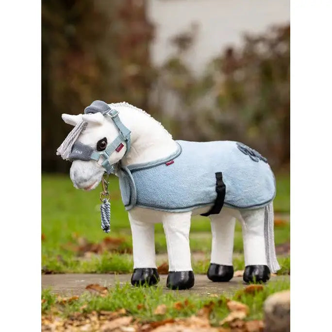 Plush Lemieux Toy Pony wearing a light blue Pony Rug Glacier blanket or coat