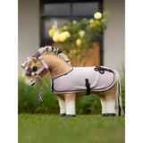 A plush light gray lemieux toy pony wearing a lilac pony rug with black trim and braided details