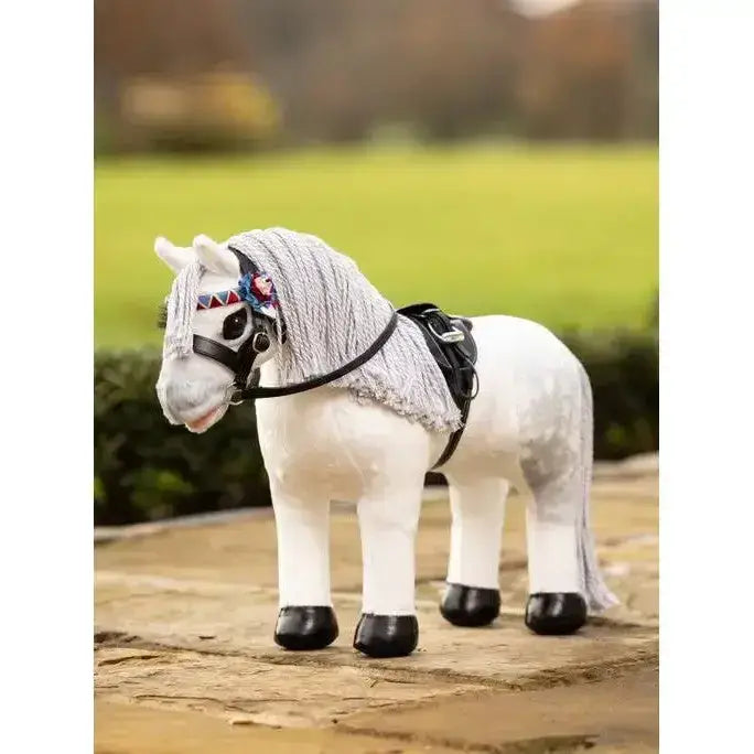 White plush lemieux toy pony with gray textured mane black hoof caps showing numnah brown saddle accessory