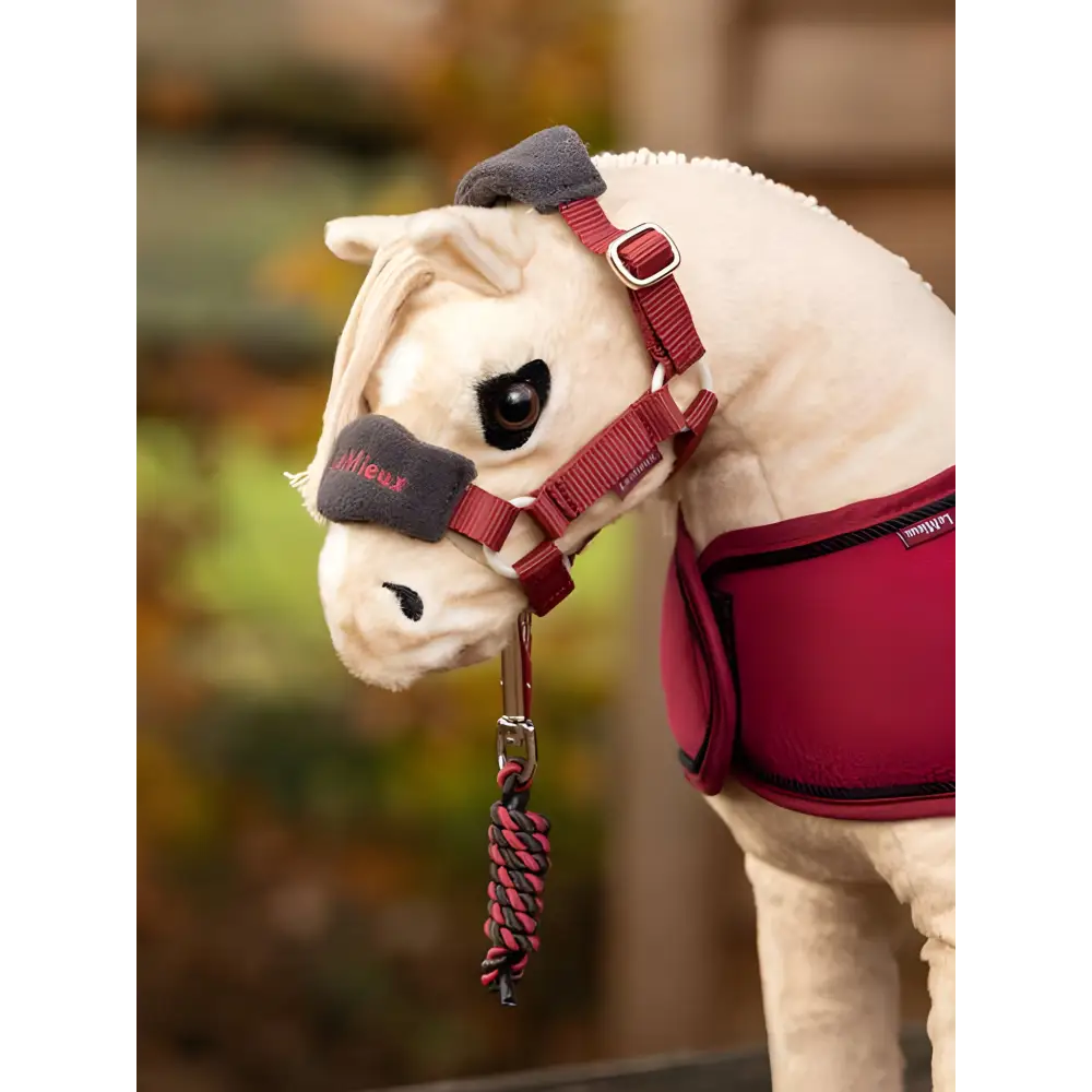 Plush Lemieux Toy Pony wearing Vogue Headcollar and blanket in Ember color