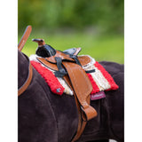 Horse saddle featuring red and white padding on a dark horse with Lemieux Toy Pony Western Pad Chilli