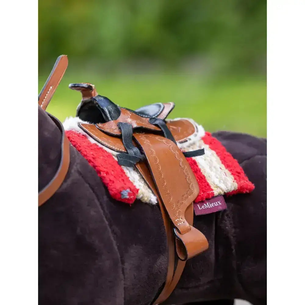 Brown leather lemieux toy pony western saddle with black accents and red white fleece pad authentic miniature western