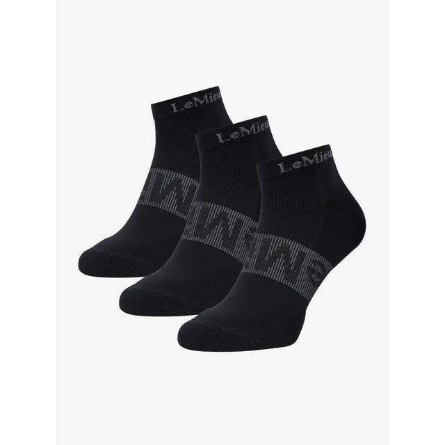 Black lemieux trainer socks with gray geometric pattern and silver logo on cuff perfect for trainers