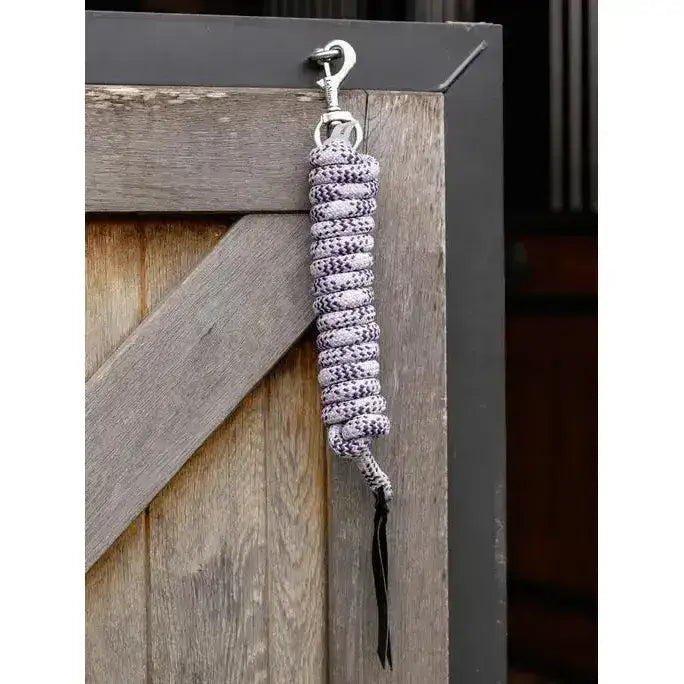 A coiled silver and black patterned lemieux training leadrope dusk peony with metal clip for easy handling
