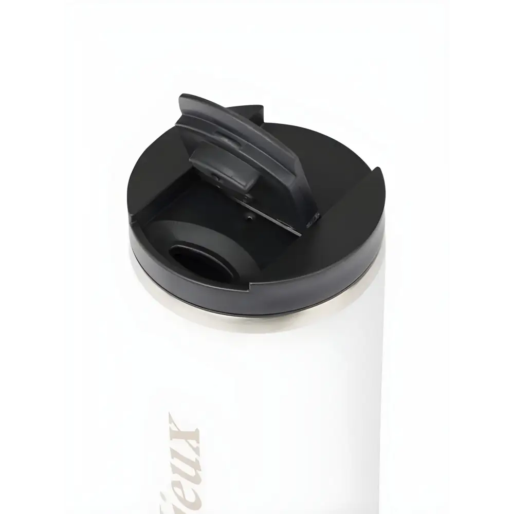 White Lemieux Travel Cup Stone with a black plastic lid for on-the-go drinking