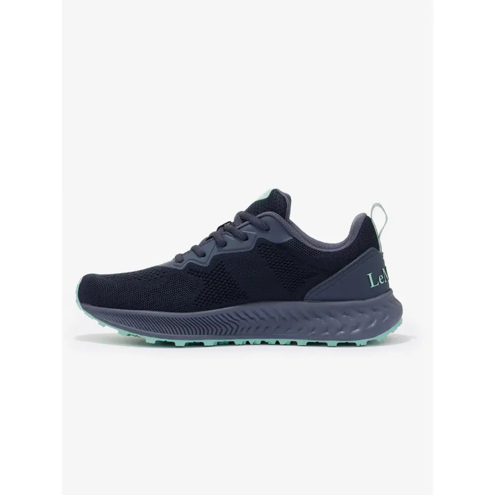 Black and gray lemieux trax-lite trainer dusk with textured knit upper teal sole accent perfect for equestrian use horses
