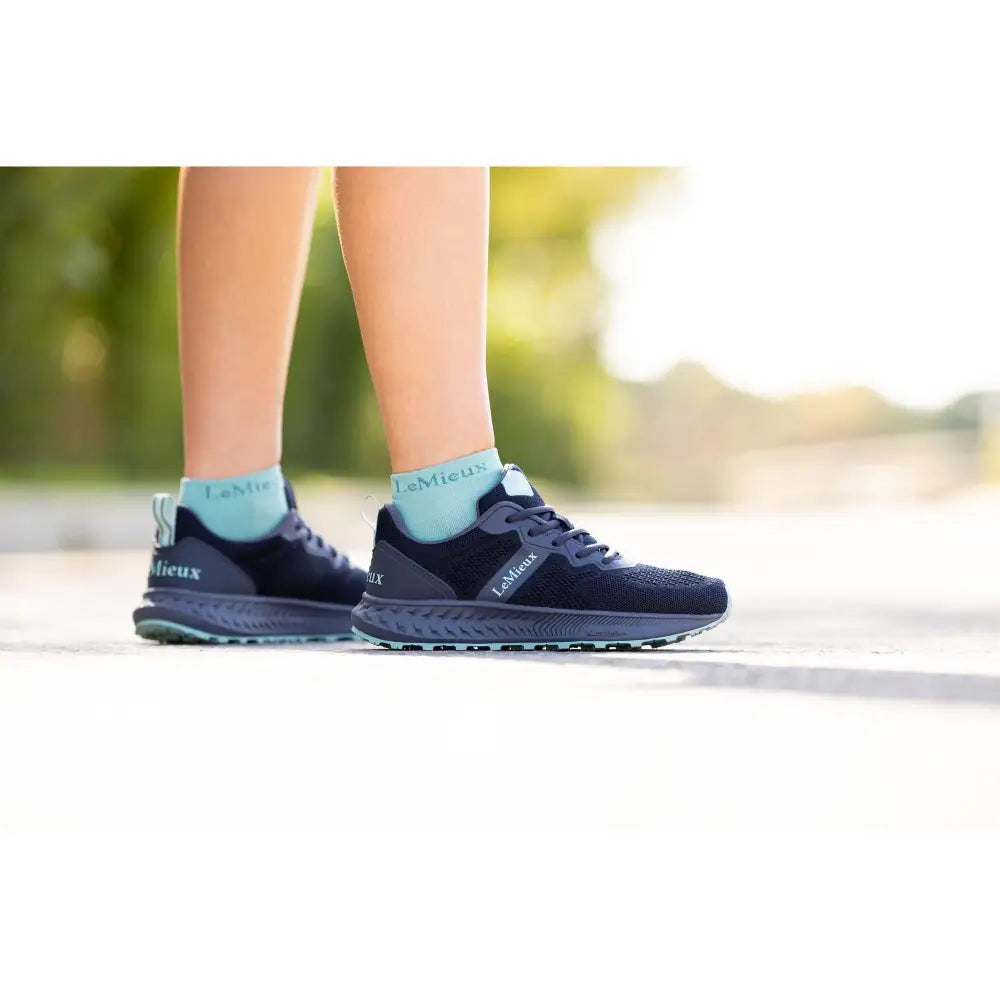 Dark blue lemieux trax-lite trainer dusk with light teal accents and textured mesh upper perfect for equestrian use