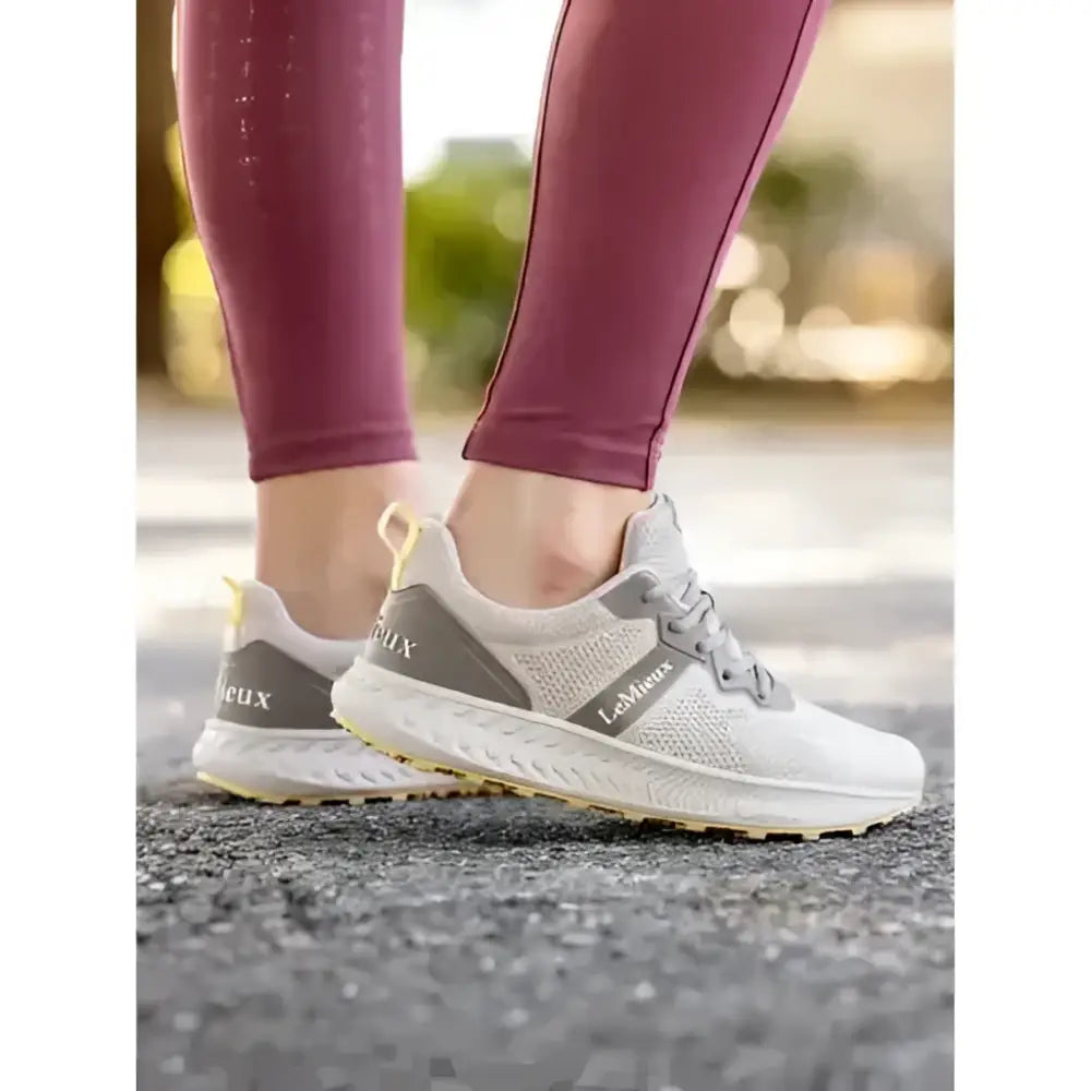Light gray and white mesh trainer pecan athletic sneakers with a sleek modern design for equestrian and horses use