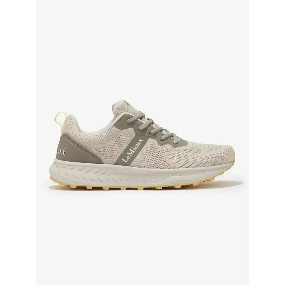 Beige and gray lemieux trax lite trainer pecan with breathable mesh upper and textured midsole for equestrian use