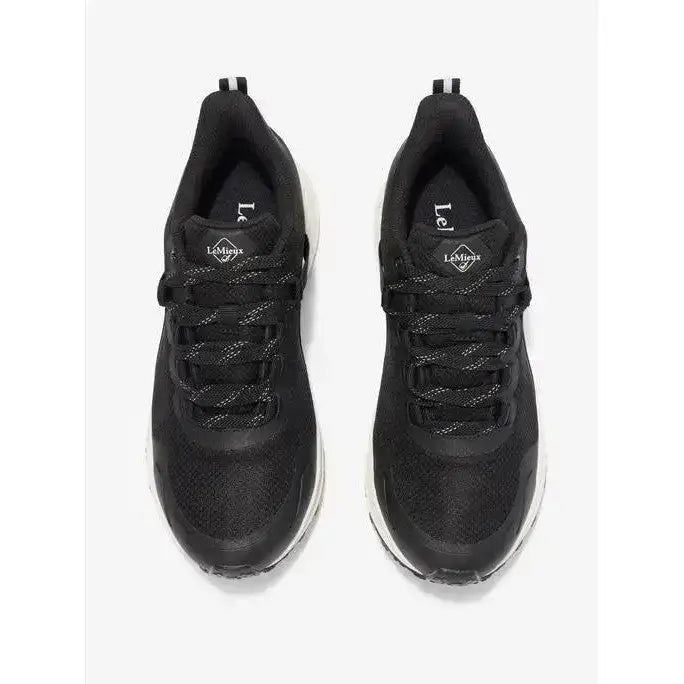 Black lemieux trax waterproof trainer with mesh upper and white rubber soles perfect for athletic use