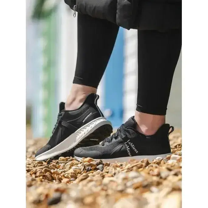 Black lemieux trax waterproof trainer with sleek textured upper and contrasting white midsole for style and comfort
