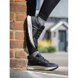Black and white lemieux trax waterproof trainer with mesh upper and rubber sole for all-weather running