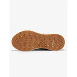 Tan rubber sole with chunky tread and michelin logo on the side of lemieux trax waterproof trainer khaki