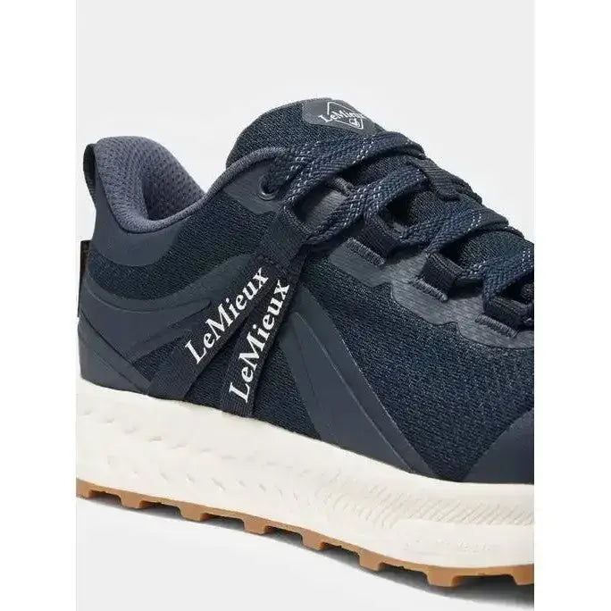 Dark navy lemieux trax waterproof all-terrain trainer with mesh synthetic leather and white sole with tan outsole
