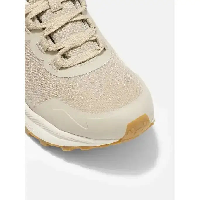 Beige mesh and rubber lemieux trax waterproof trail running shoe with tan outsole and durable waterproof trainer stone design