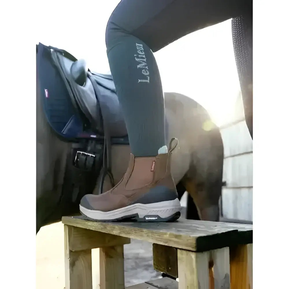 Brown and gray lemieux traxion chelsea waterproof riding boot with sleek modern design and stirrup-friendly heel