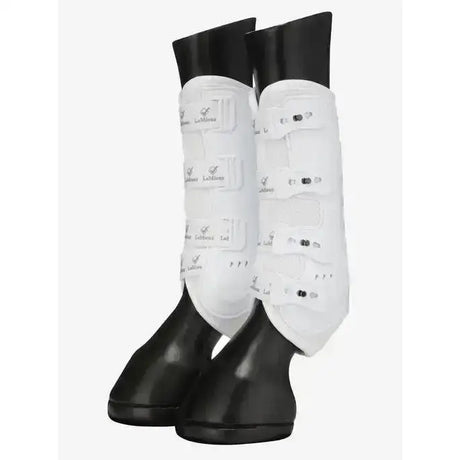 White leather lemieux ultra mesh snug boots hind with black rubber tips and silver logo patches on horse legs