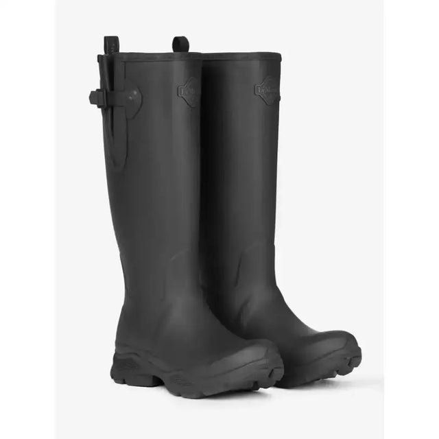 Black rubber lemieux ultra stride wellington boots with side buckle strap and logo emblem near the top